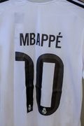 Camisa Real Madrid Local 25-26 Versión Jugador UCL Mbappé 10